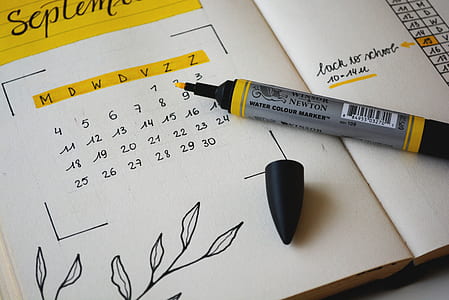 black pen marker on september calendar thumbnail