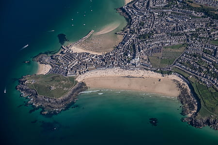 aerial view photography of high rise building near body of water thumbnail