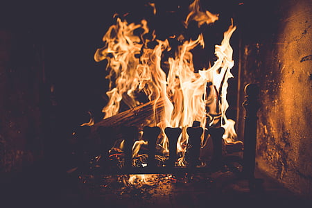 firewood burning inside square metal container thumbnail