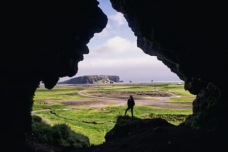 person standing on cave thumbnail