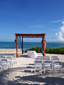 white wooden folding chairs in front of red gazebo thumbnail