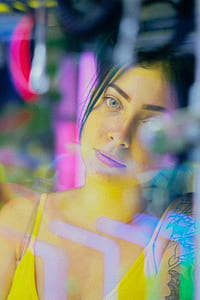 woman looking through clear glass panel thumbnail