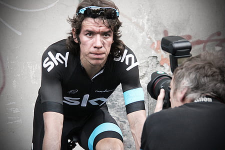 man taking photo on cyclist thumbnail