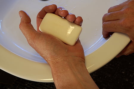 closeup photo of person holding bar soap thumbnail
