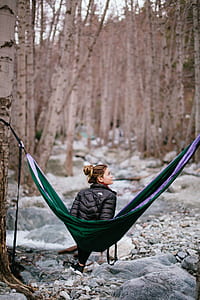 woman sitting on green hammock at daytime thumbnail
