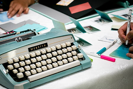 close up photo of blue and white Webster typewriter thumbnail