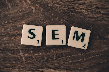 three white-and-black scrabble tiles thumbnail