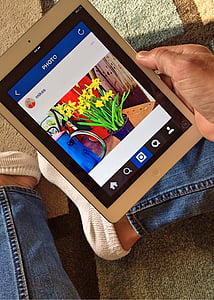 person holding silver iPad thumbnail