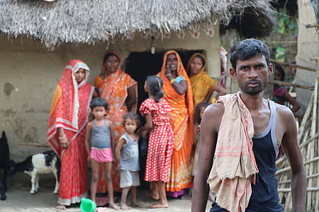 man standing in front female near house thumbnail