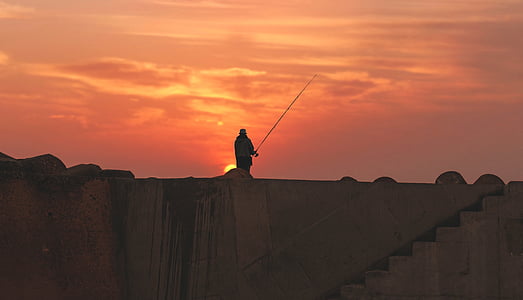 man standing on building thumbnail