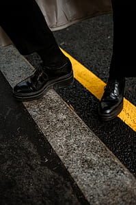 person stepping on road gutter thumbnail