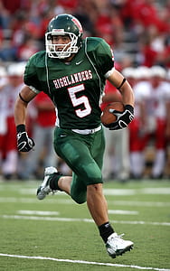 football player holding football thumbnail