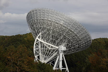 white and grey satellite surrounded by trees at daytime thumbnail