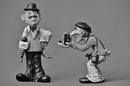 two male holding camera and microphone figurine thumbnail
