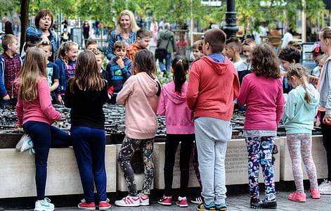 children standing on gray concrete city scale model during daytime thumbnail