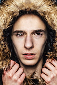 person wearing fur hooded jacket thumbnail