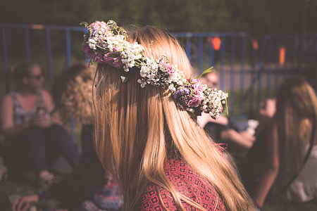 blonde haired in red top wearing flower crown in tilt shift photography thumbnail