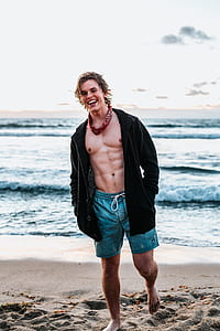 man standing on seashore thumbnail