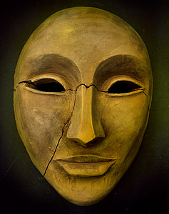 beige face mask figurine thumbnail