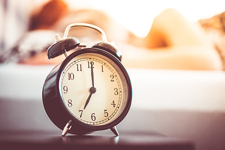 Vintage Alarm Clock and Sleeping Woman thumbnail