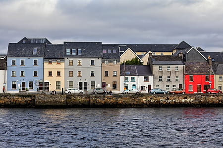 multicolored houses near body of water during daytime thumbnail
