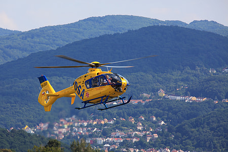 selective focus photography of flying yellow helicopter thumbnail