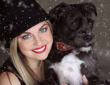 woman carrying the black and white shih tzu thumbnail