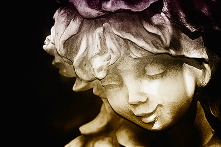 close-up photo of boy concrete statue thumbnail