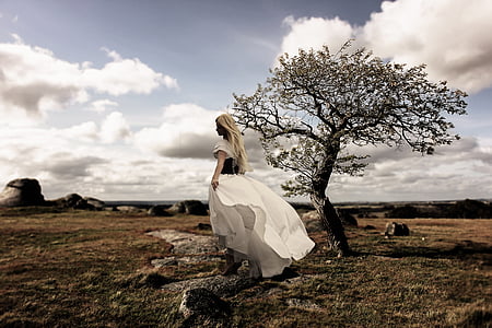 woman in white dress in the middle of the field thumbnail