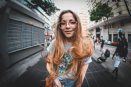 portrait photography of woman wearing eyeglasses thumbnail