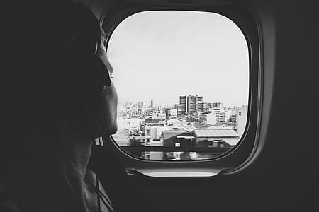 person listening to music while looking outside window thumbnail