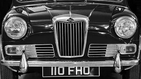 grayscale photography of classic vehicle with NO FHO license plate thumbnail