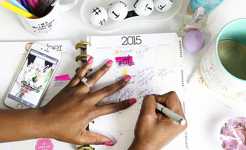 person writing calendar planner thumbnail