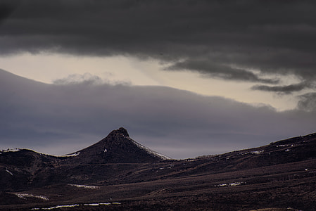 brown mountain under white clouds thumbnail