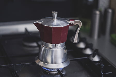silver moka pot on gas stove thumbnail