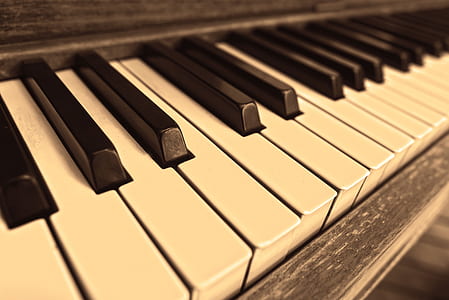 brown wooden upright piano in macro lens photography thumbnail