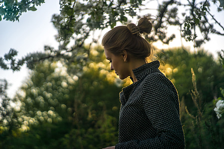 woman staring down during daytime thumbnail