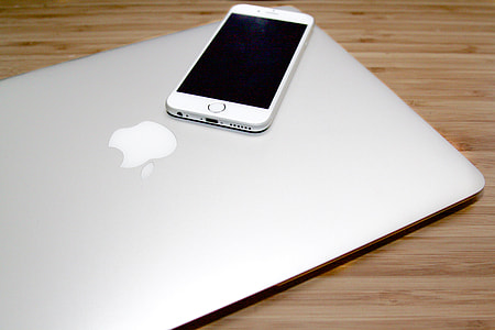 silver iPhone 5s on silver MacBook thumbnail