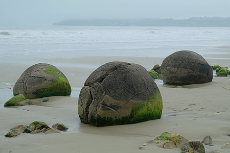 gray concrete stone beside the seashore thumbnail