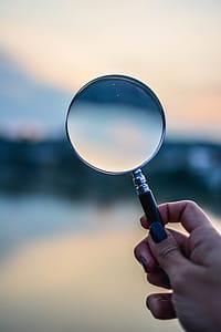 Selective Focus Photo of Magnifying Glass thumbnail