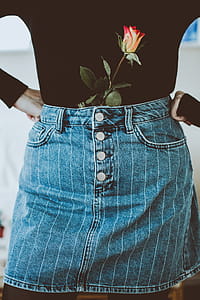 Woman In Black Long-sleeved Shirt And Blue Denim Skirt thumbnail