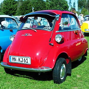 red 3-wheeled vehicle on green grass thumbnail