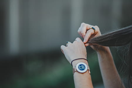 woman holding hair thumbnail