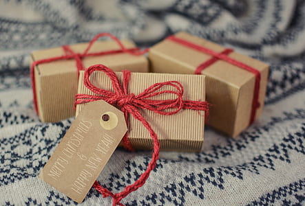 three rectangular brown boxes on gray and black textile thumbnail
