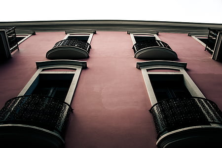 low angle photography of brown building thumbnail