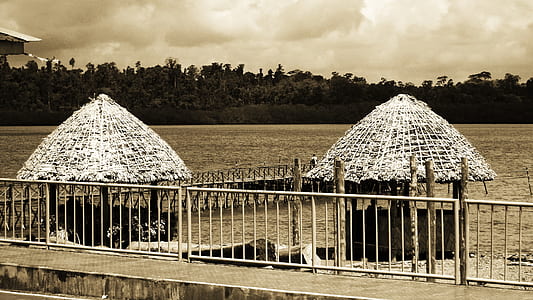 Grayscale Photo of Huts thumbnail