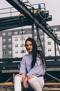 woman sitting on brown wooden surface thumbnail