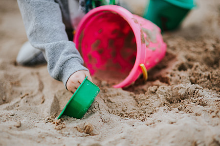 Toddler playing in the sand thumbnail