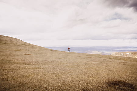 person on the edge of mountain thumbnail