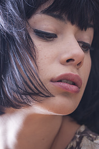 woman looking down posing for the camera thumbnail